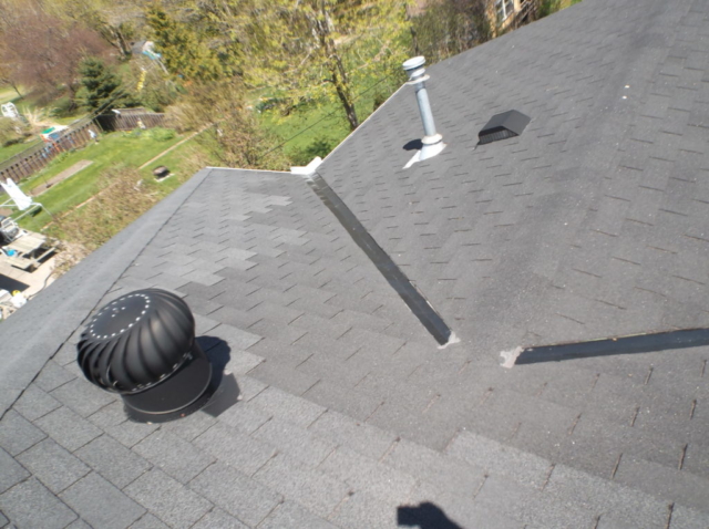 Roof Shingles Replaced at different times.